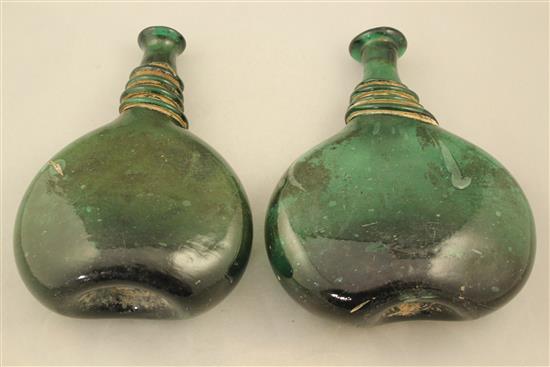 Two Persian green glass saddle flasks, 18th / 19th century, 23cm.